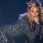  Beyonce becomes a Human disco ball in tight black and Silver Glitter Bodysuit