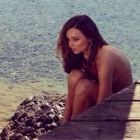  Miranda Kerr Sizzles on the Beach in racy Swimwear as she Covers Elle Spain