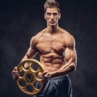  All You Need Is a Weight Plate to Demolish Your Abs