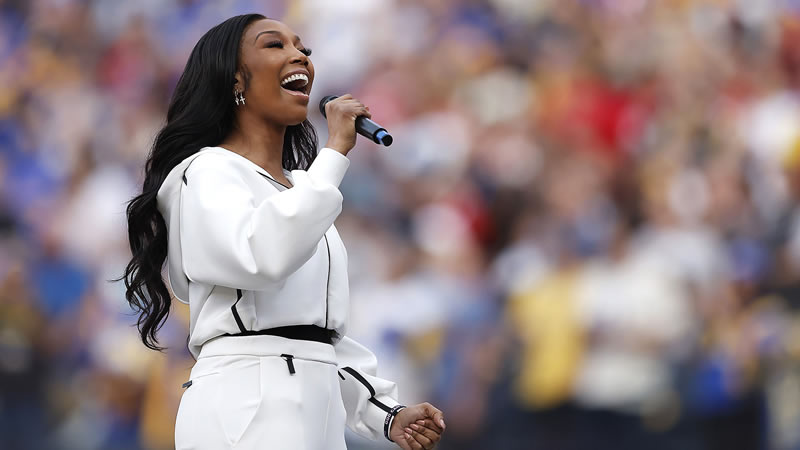  Brandy Channels Whitney Houston’s Super Bowl Style as She Sings the National Anthem at NFC Championship Game